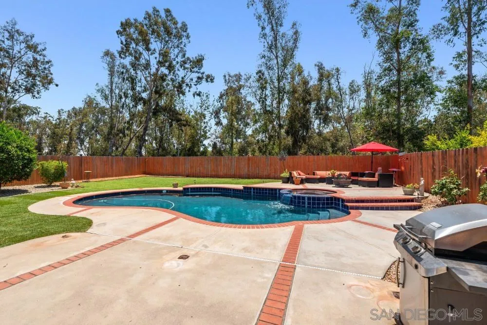 13227 Treecrest Street Poway, CA 92064 - Photo 2 of 32 a view of backyard with swimming pool and seating space
