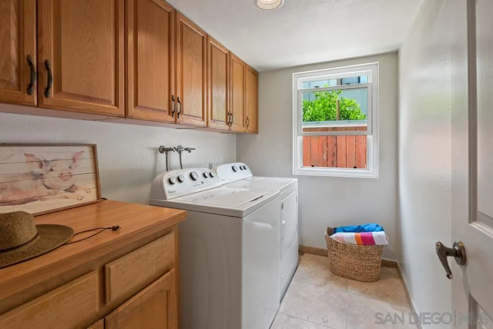 13227 Treecrest Street Poway, CA 92064 - Photo 27 of 32 a utility room with dryer and washer