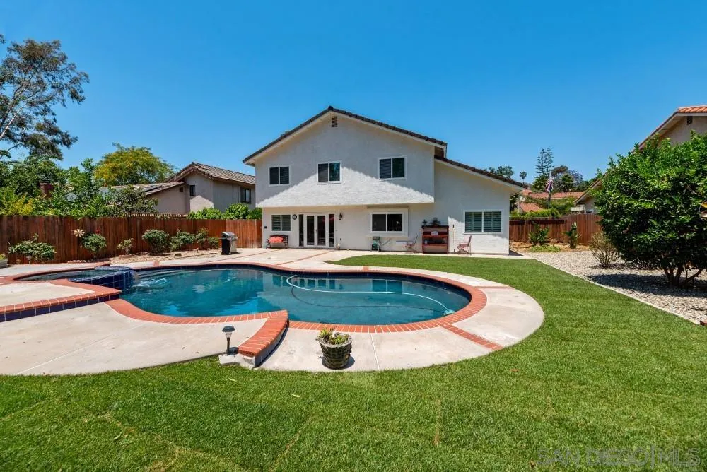 13227 Treecrest Street Poway, CA 92064 - Photo 30 of 32 a view of a house with swimming pool and yard