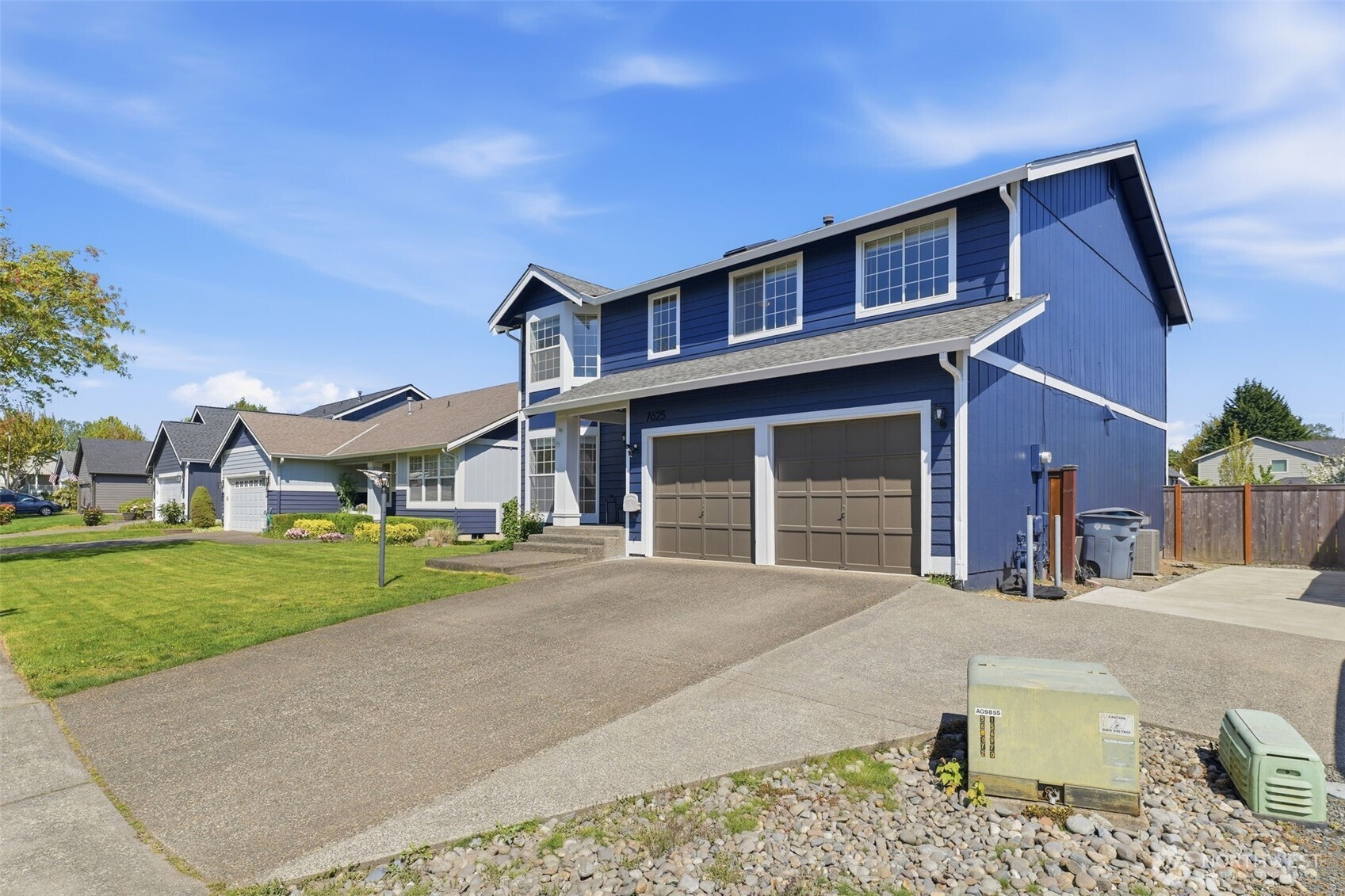 7625 148th Avenue East Sumner, WA 98390 - Photo 1 of 40 a front view of a house with a yard