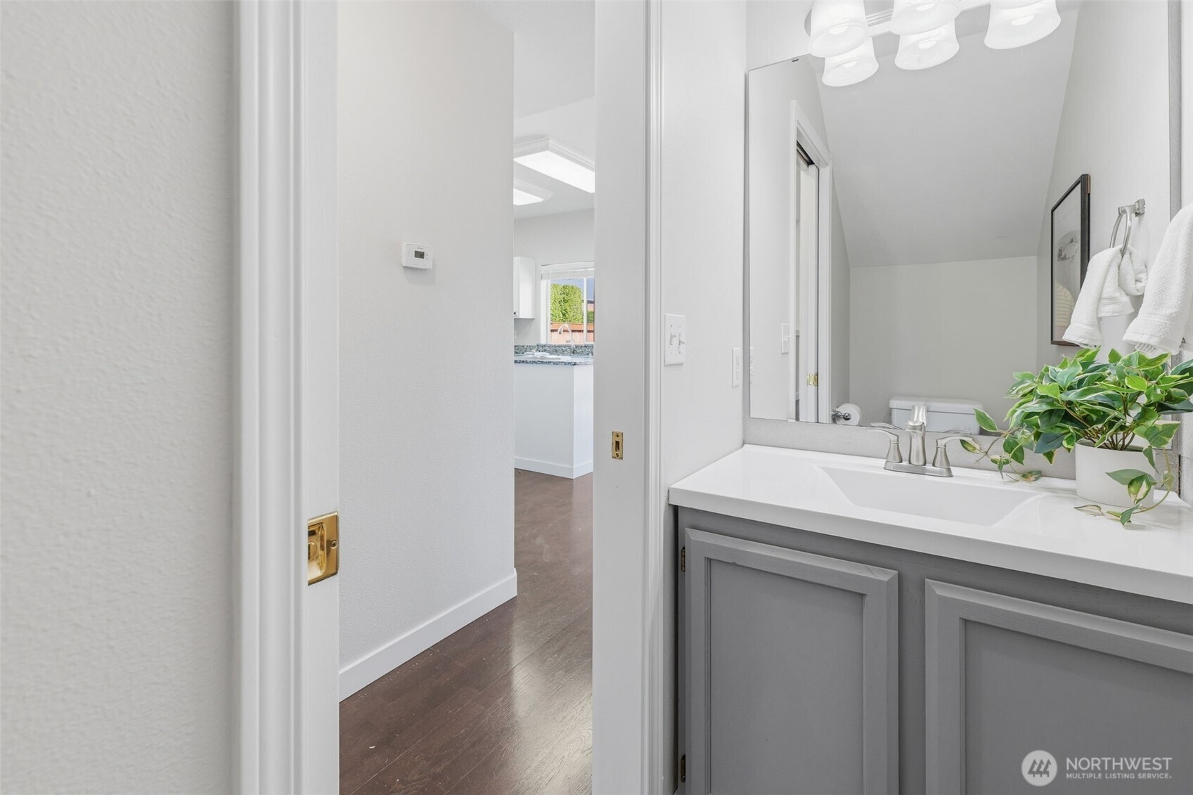 7625 148th Avenue East Sumner, WA 98390 - Photo 11 of 40 a bathroom with a sink and a mirror
