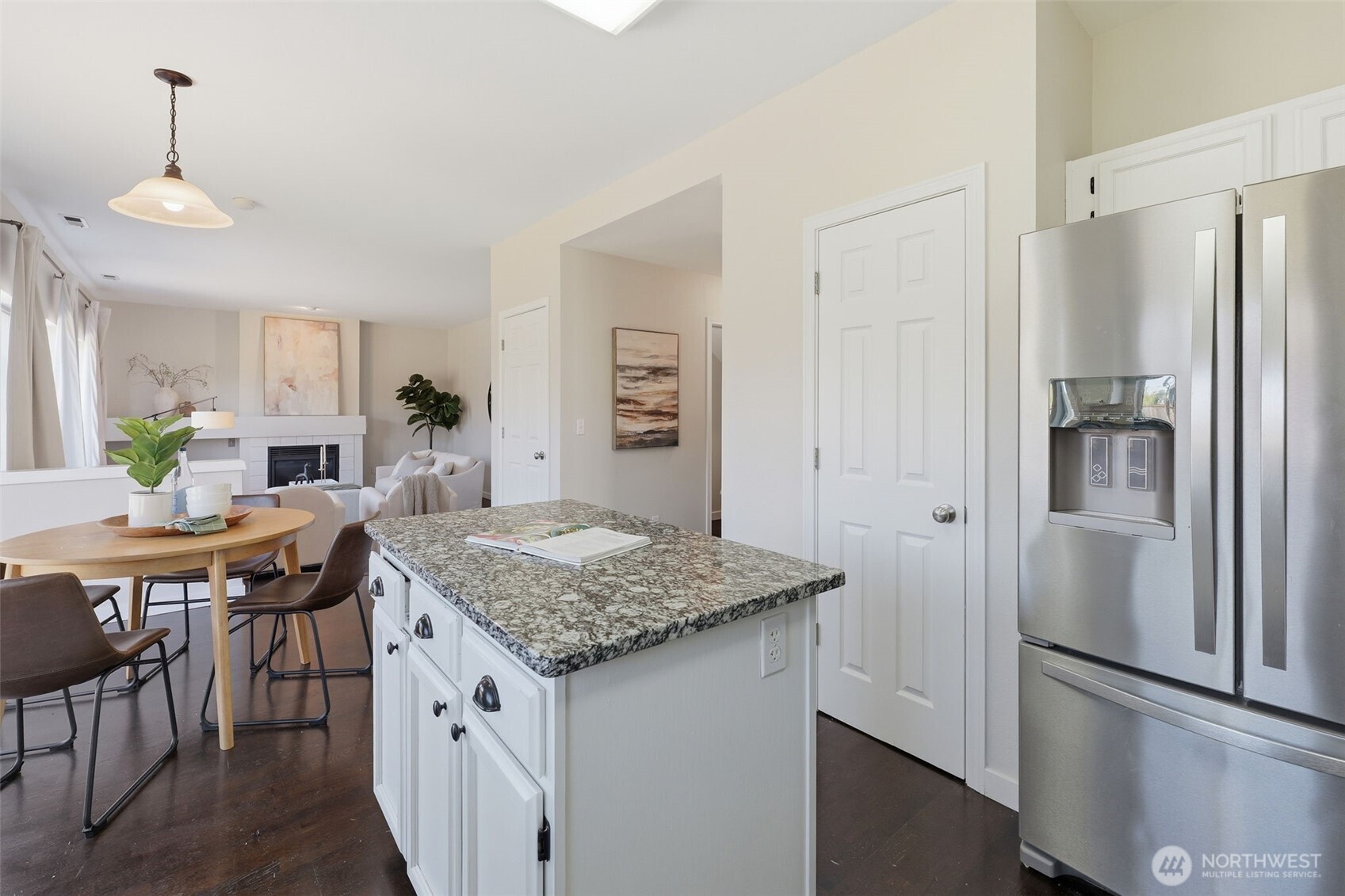 7625 148th Avenue East Sumner, WA 98390 - Photo 15 of 40 a kitchen with stainless steel appliances granite countertop refrigerator sink and stove