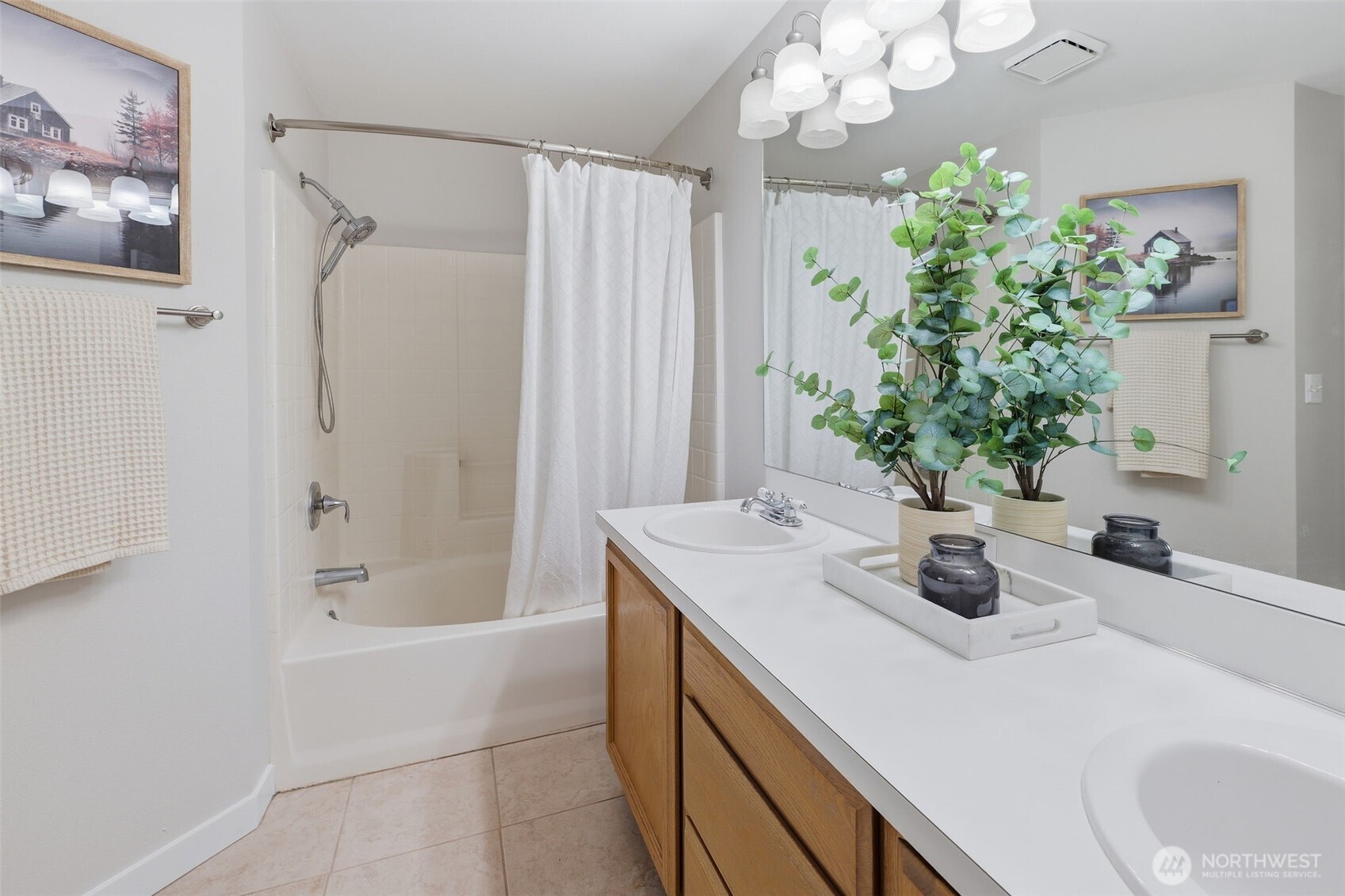 7625 148th Avenue East Sumner, WA 98390 - Photo 23 of 40 a bathroom with a granite countertop sink a mirror and a shower