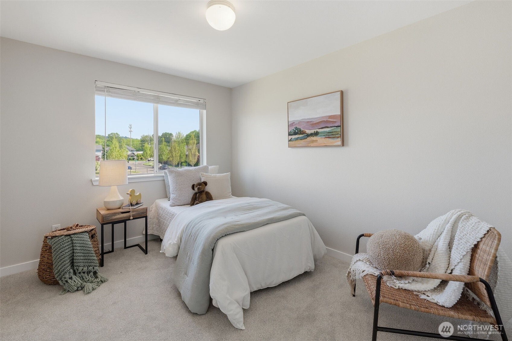 7625 148th Avenue East Sumner, WA 98390 - Photo 25 of 40 a bed room with a bed and a chair