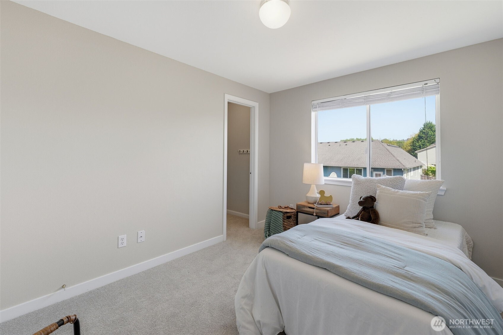 7625 148th Avenue East Sumner, WA 98390 - Photo 26 of 40 a bedroom with a bed and window