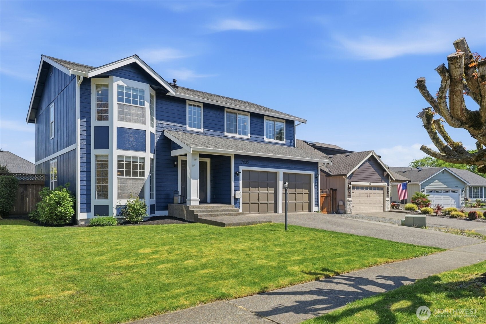 7625 148th Avenue East Sumner, WA 98390 - Photo 3 of 40 a front view of a house with a yard