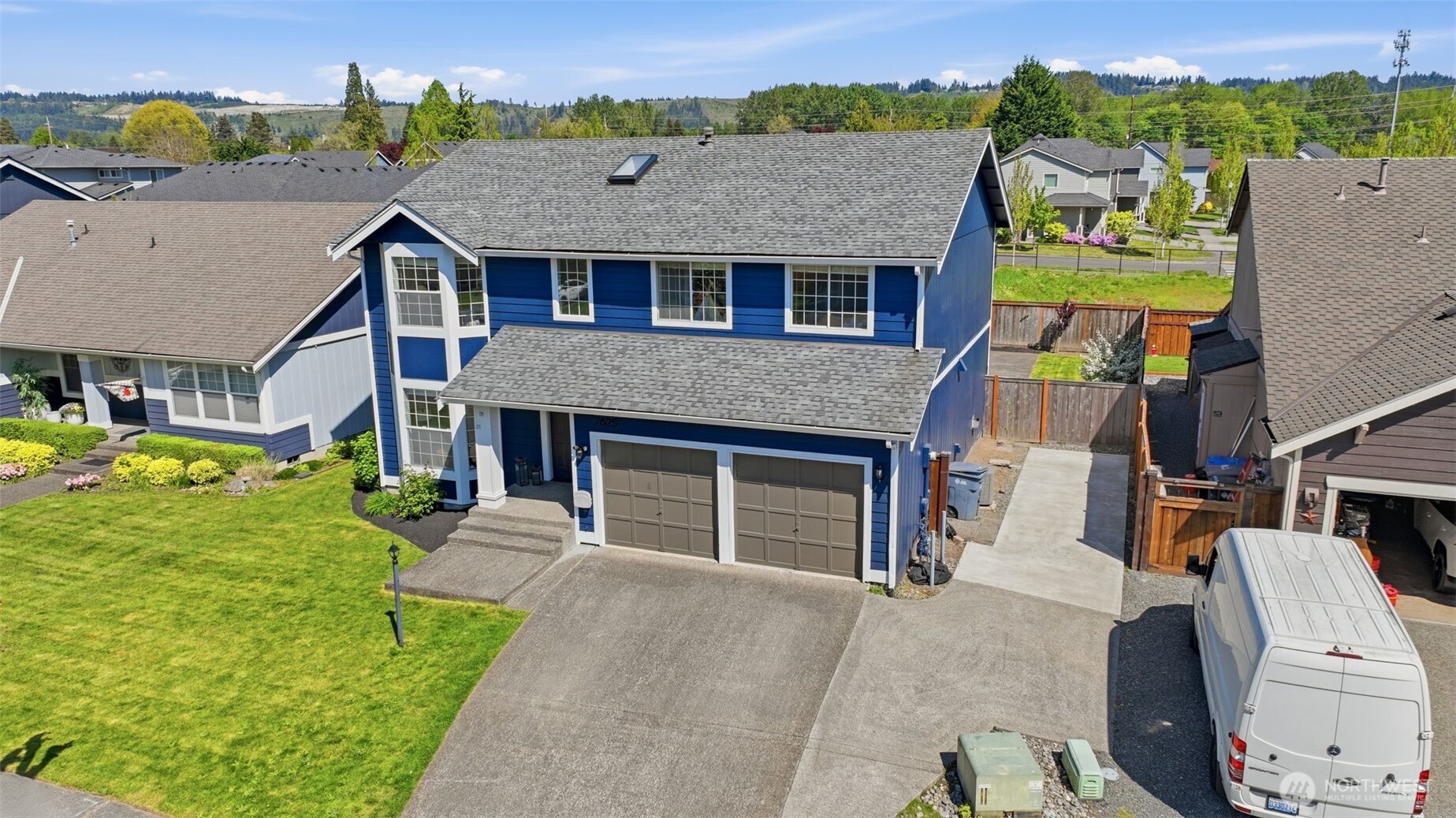 7625 148th Avenue East Sumner, WA 98390 - Photo 33 of 40 a aerial view of a house with swimming pool and a yard