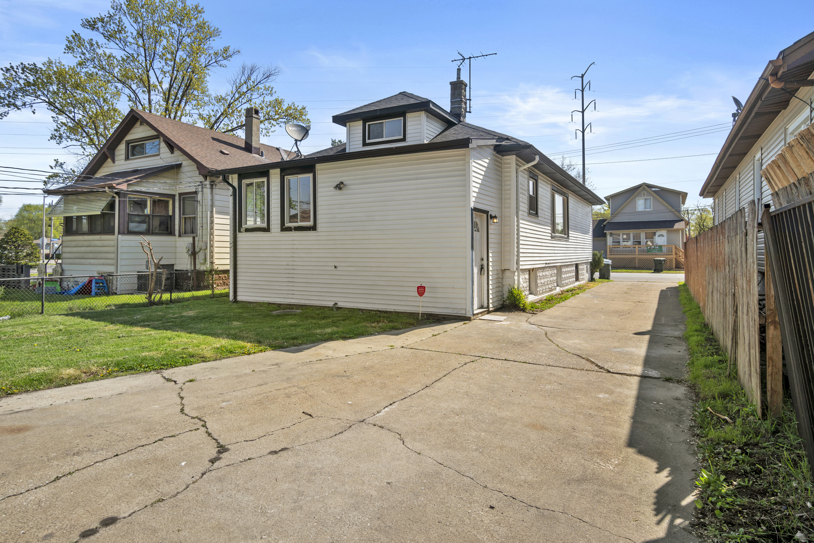 Undisclosed Address Dolton, IL 60419 - Photo 16 of 17 a front view of a house with a yard