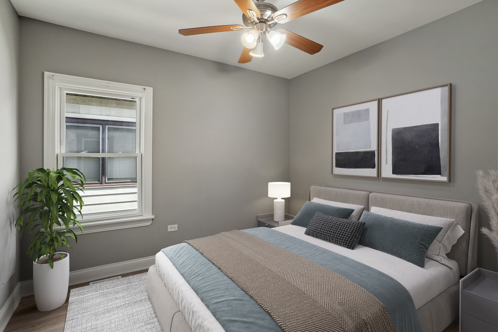 Undisclosed Address Dolton, IL 60419 - Photo 9 of 17 a bedroom with a bed and a potted plant