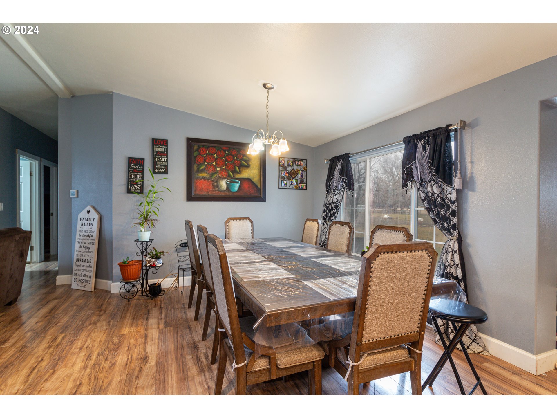 80265 Canal Road Hermiston, OR 97838 - Photo 4 of 26 a view of a dining room with furniture and wooden floor