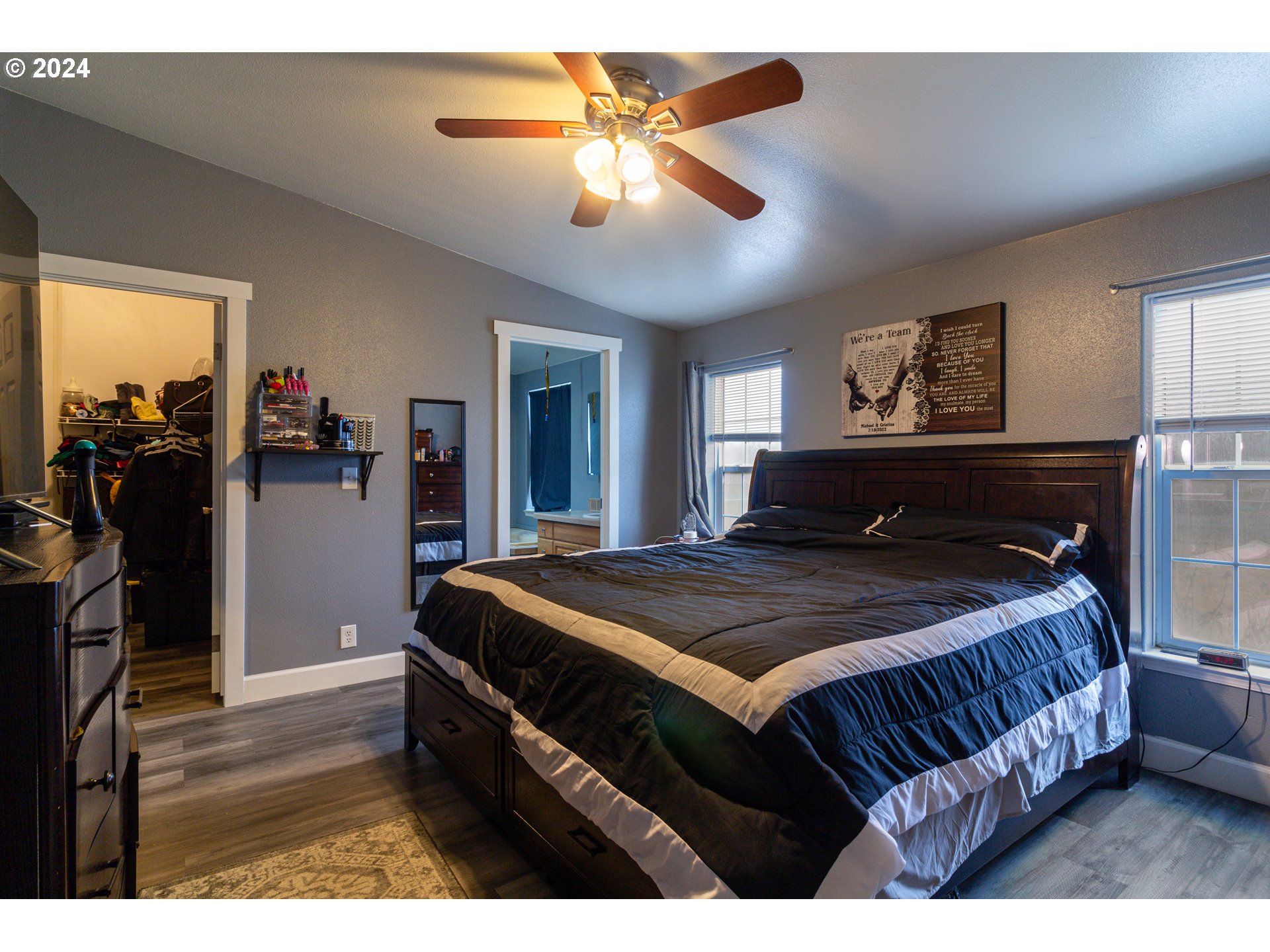 80265 Canal Road Hermiston, OR 97838 - Photo 8 of 26 a bedroom with a bed and a chandelier