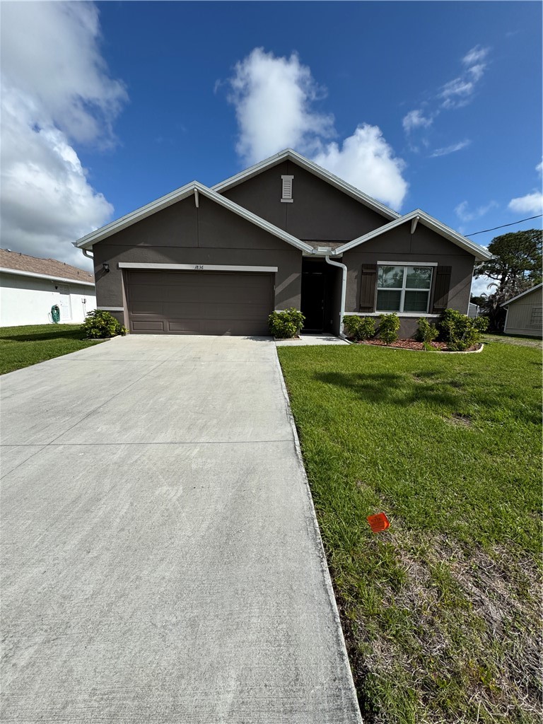 a front view of a house with yard