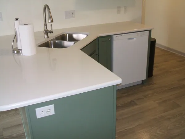a kitchen with a stove and a refrigerator