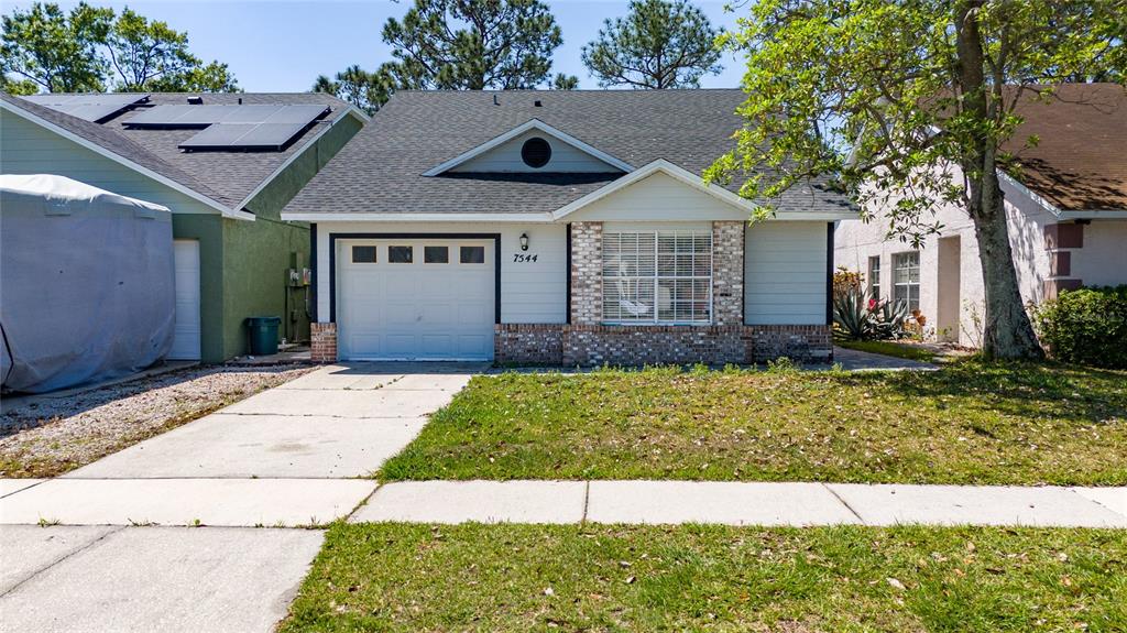 a house view with a garden space