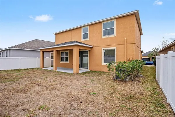 a house view with a backyard space