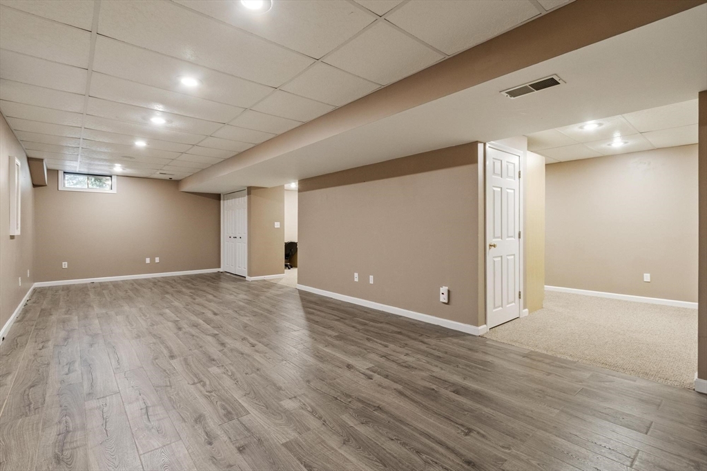 4 Ridge Road Pepperell, MA 01463 - Photo 36 of 42 a view of an empty room with wooden floor
