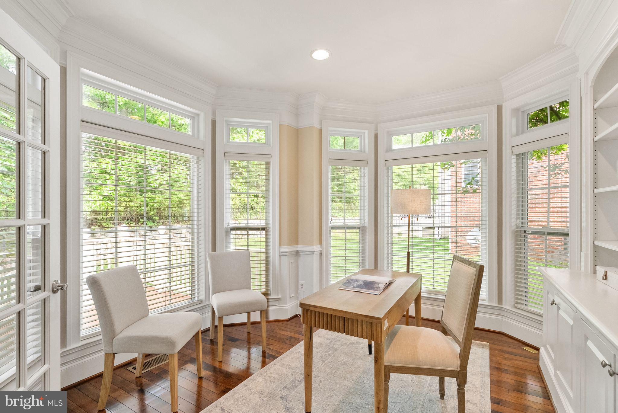 7534 Red Hill Drive Springfield, VA 22153 - Photo 23 of 90 a view of a dining room with furniture large windows and wooden floor
