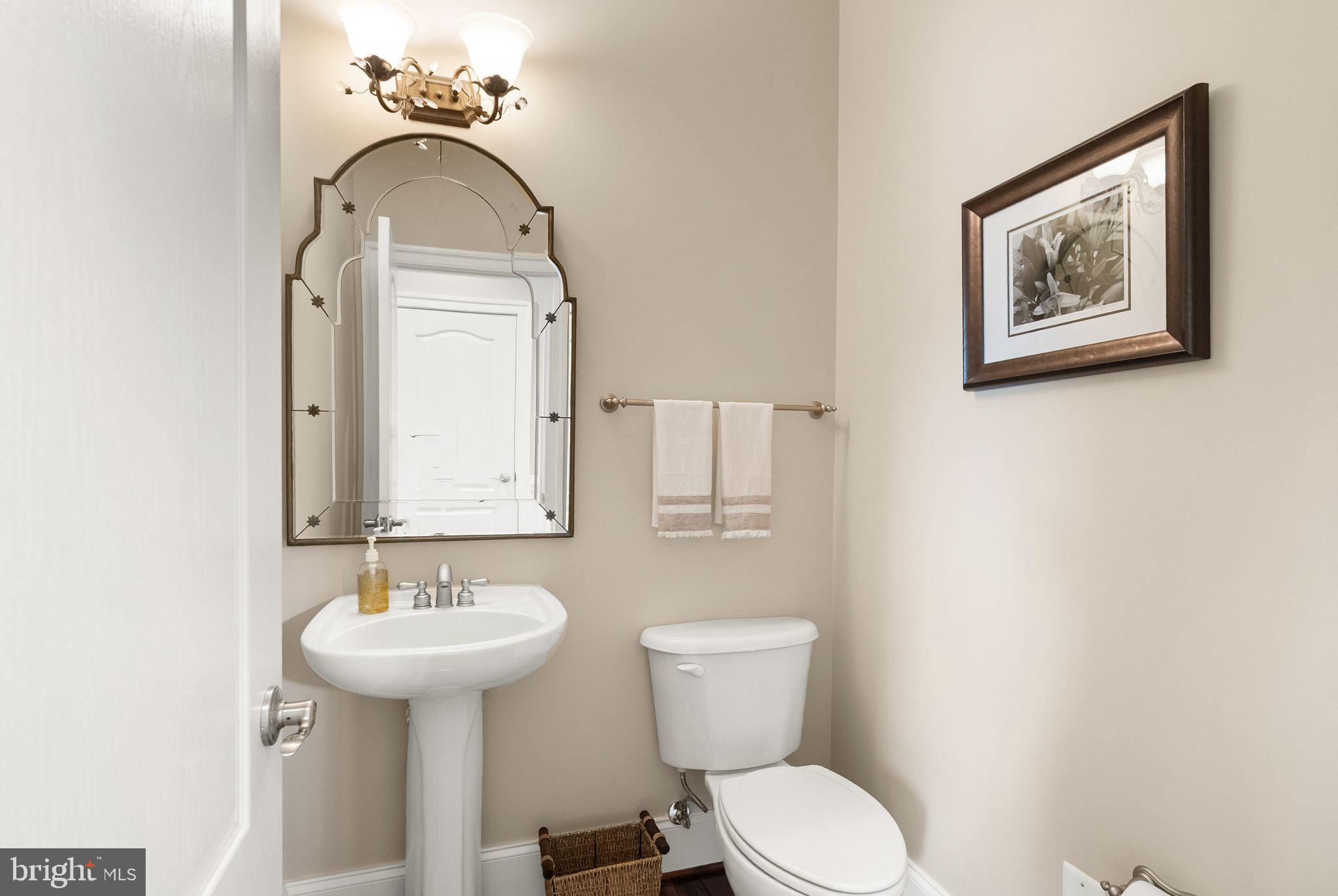 7534 Red Hill Drive Springfield, VA 22153 - Photo 32 of 90 a bathroom with a toilet sink and mirror