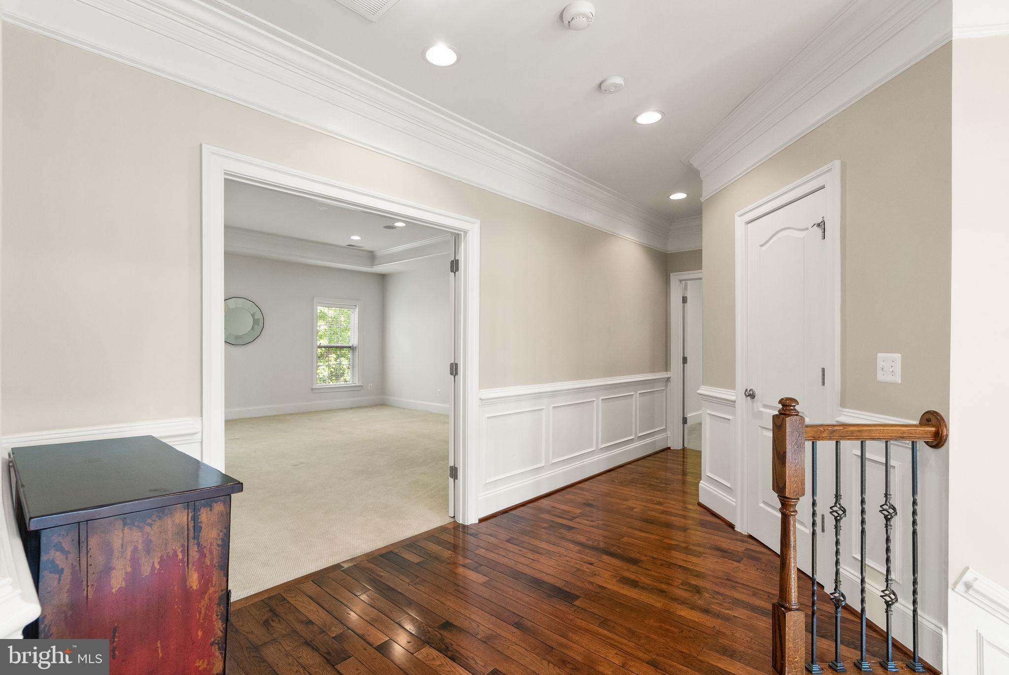 7534 Red Hill Drive Springfield, VA 22153 - Photo 39 of 90 a view of a hallway with wooden floor and staircase