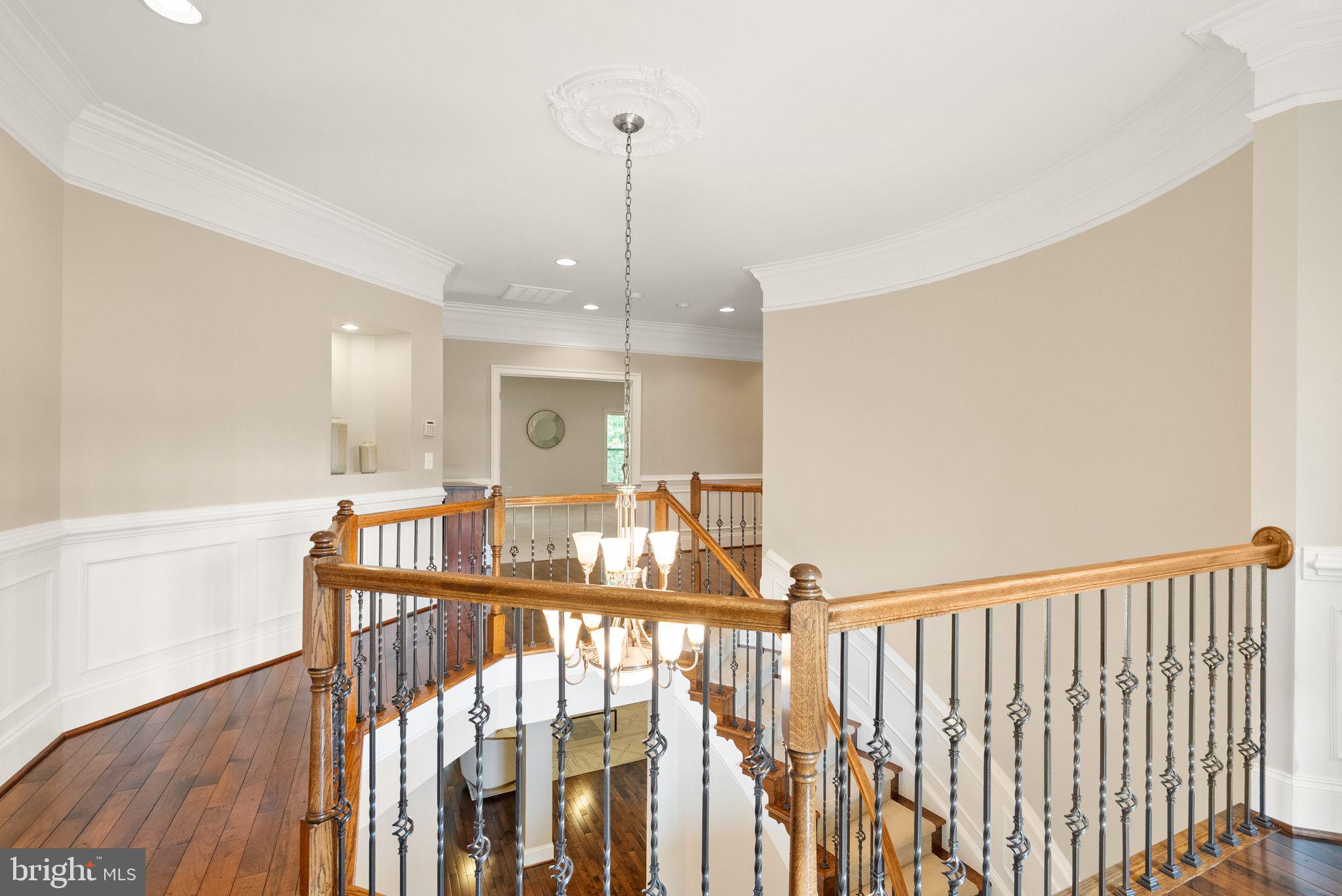 7534 Red Hill Drive Springfield, VA 22153 - Photo 40 of 90 a view of a hallway with a dining table chairs