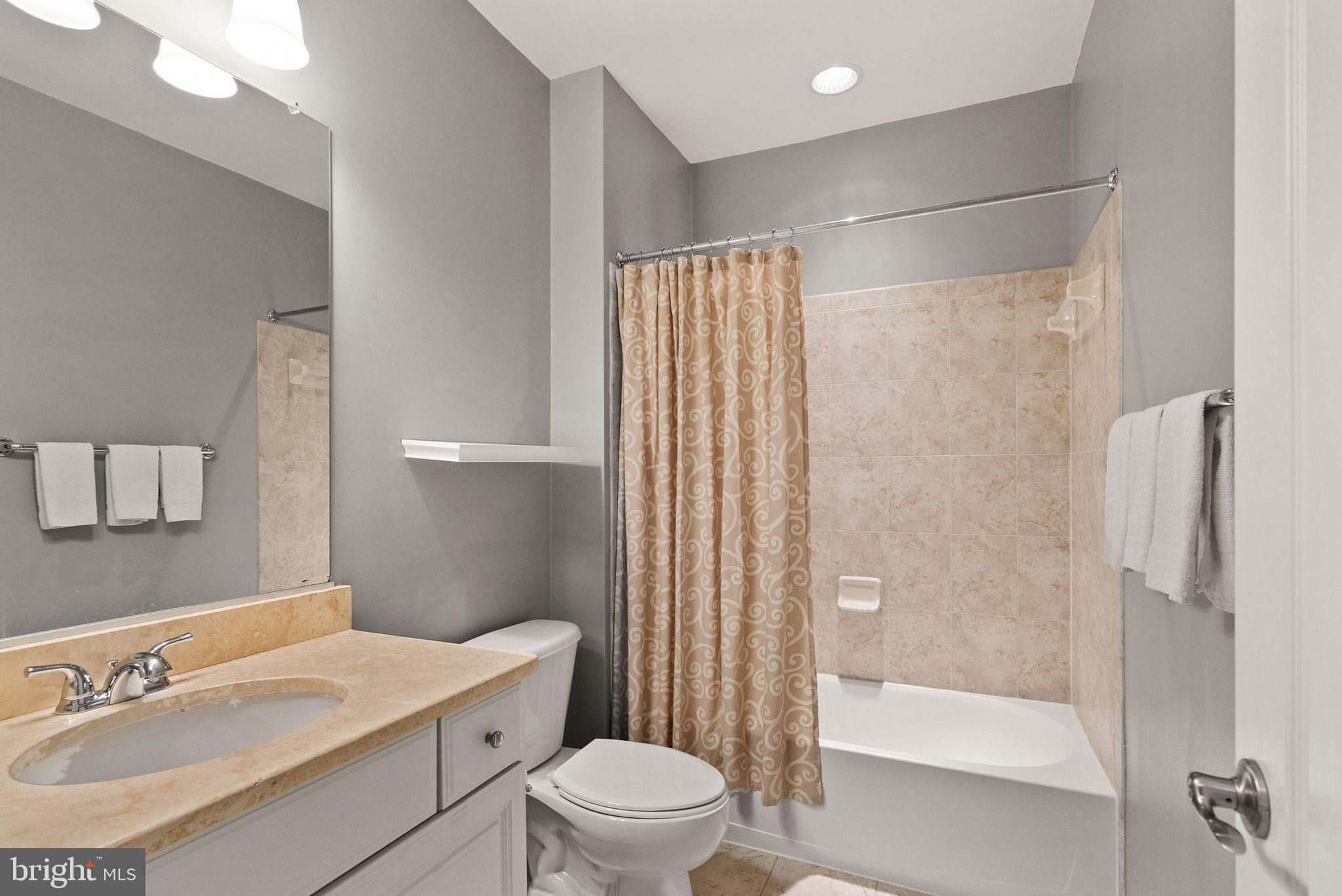 7534 Red Hill Drive Springfield, VA 22153 - Photo 75 of 90 a bathroom with a sink toilet and shower