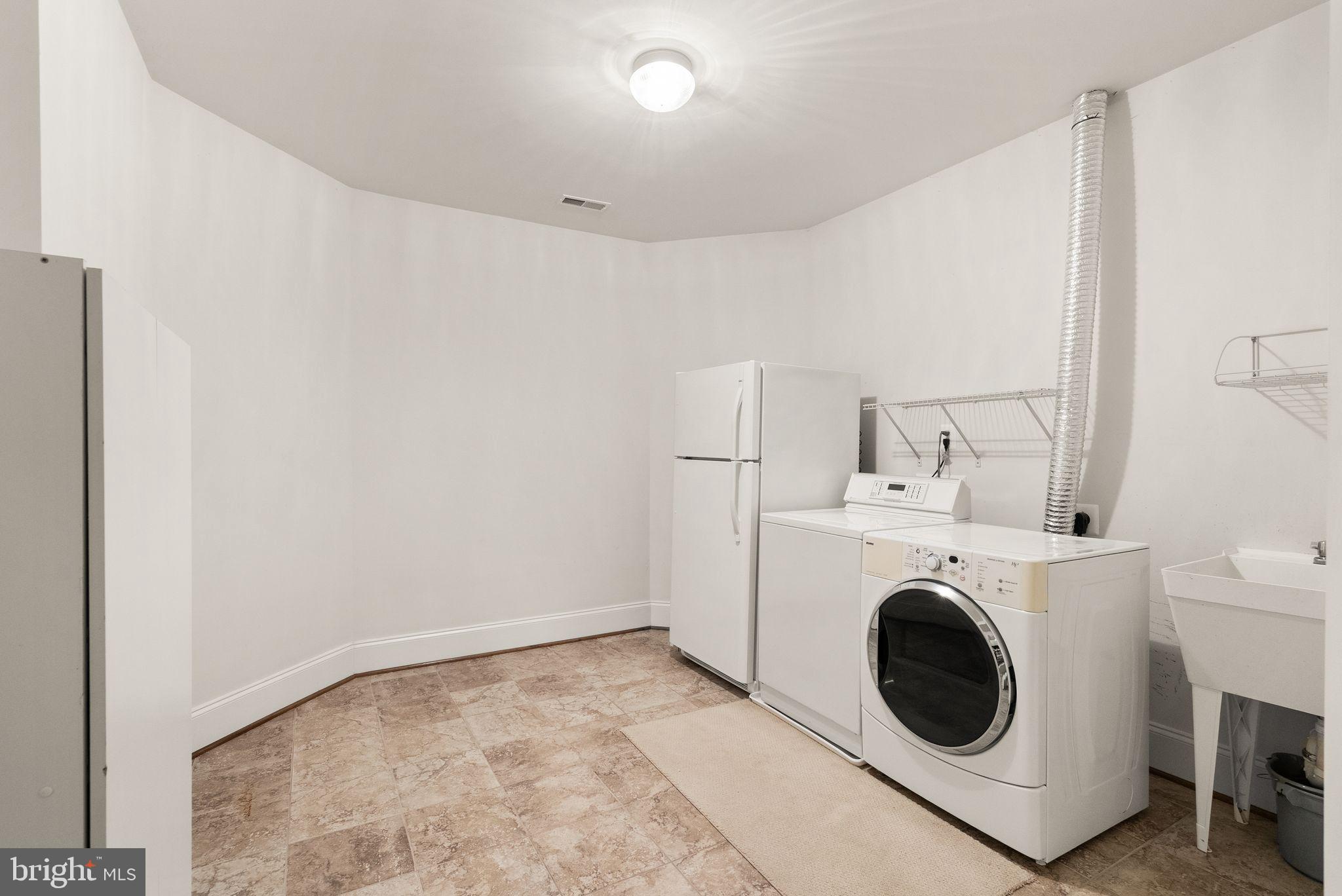 7534 Red Hill Drive Springfield, VA 22153 - Photo 76 of 90 a utility room with dryer and washer