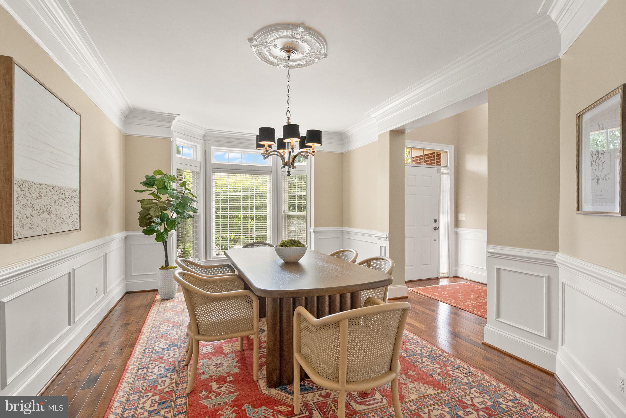 7534 Red Hill Drive Springfield, VA 22153 - Photo 9 of 90 a dining room with furniture a chandelier and wooden floor