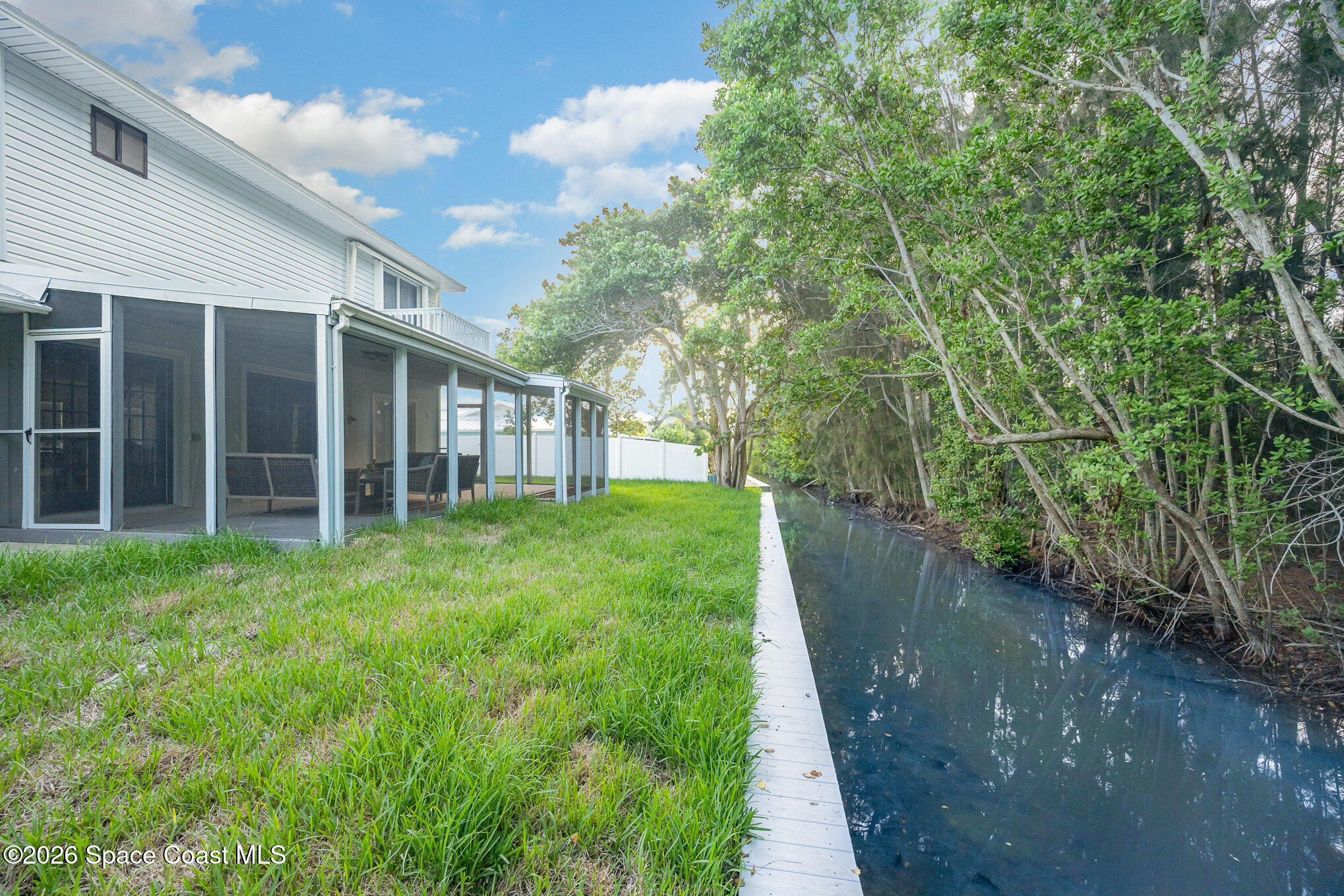 362 Nikomas Way Melbourne Beach, FL 32951 - Photo 26 of 32 a view of a big yard with plants and large trees