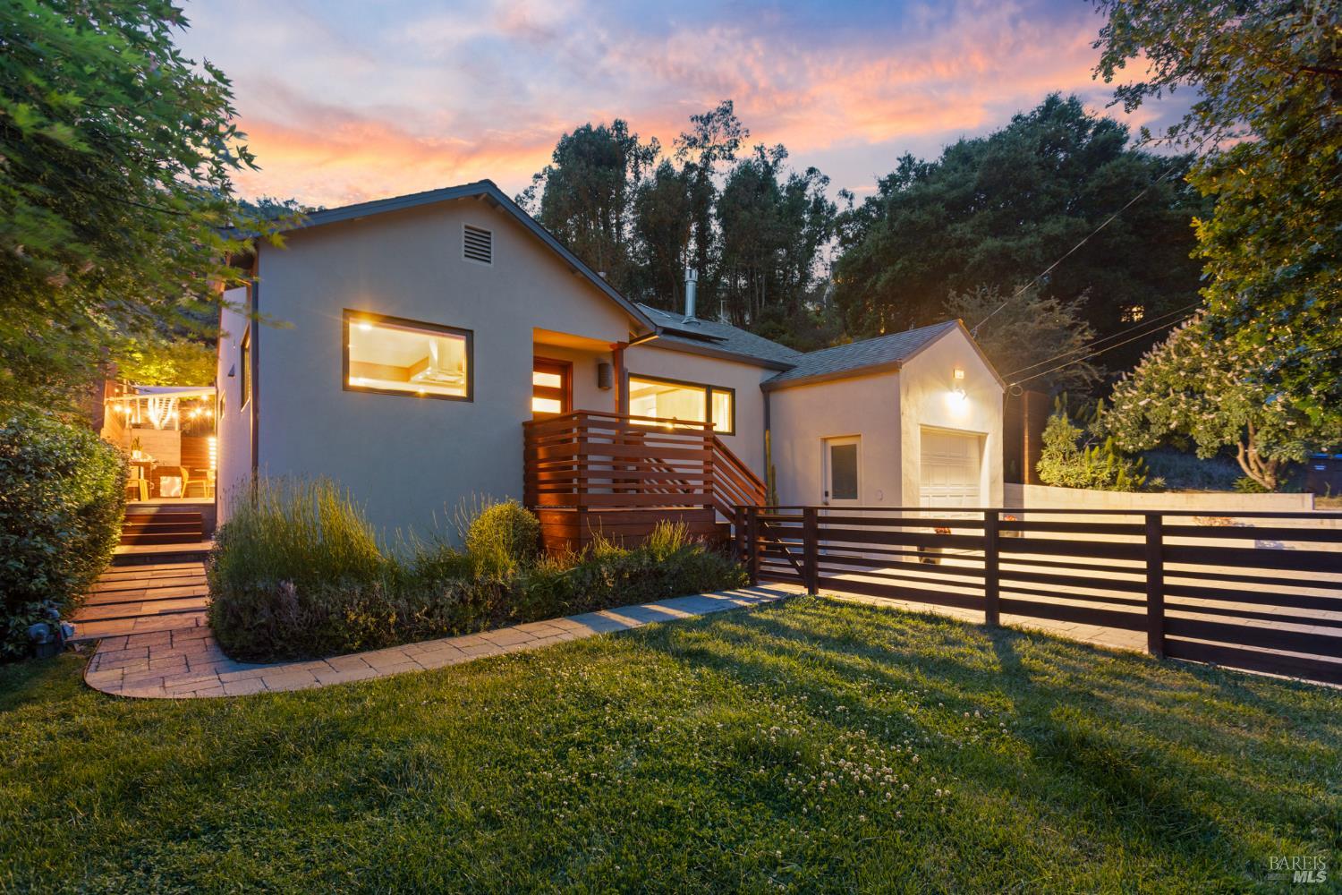 a front view of a house with garden