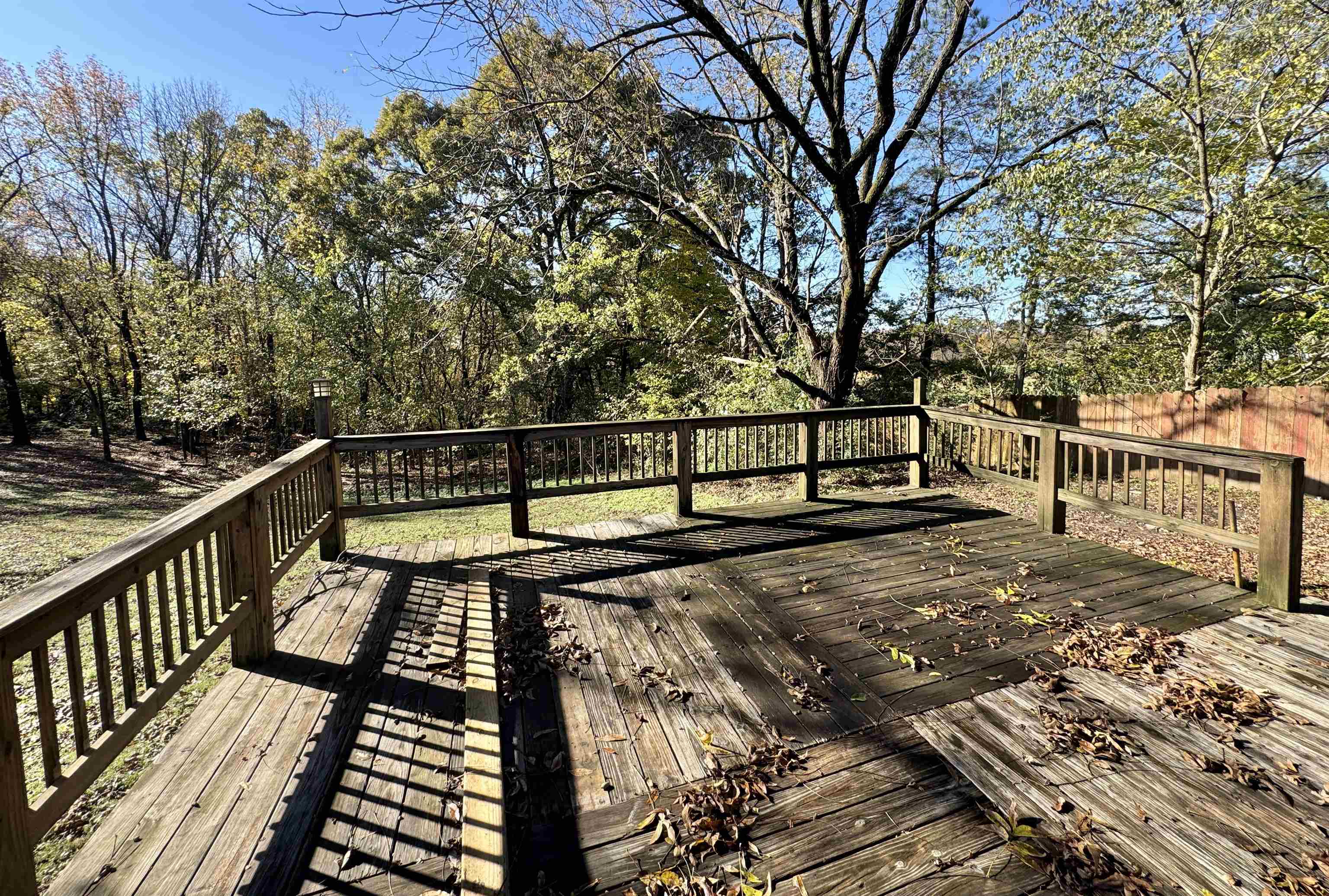 35 Ellis Loop Ripley, TN 38063 - Photo 15 of 18 a view of a balcony with wooden bench and trees