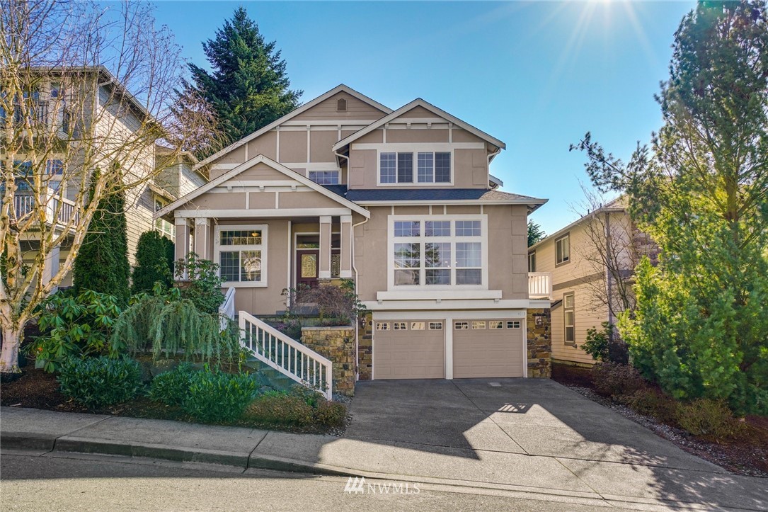 4113 Northeast 27th Place Renton, WA 98059 - Photo 1 of 27 a front view of a house with a yard
