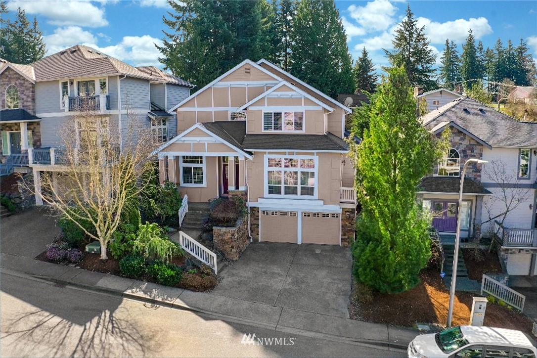 4113 Northeast 27th Place Renton, WA 98059 - Photo 27 of 27 a front view of a house with a yard and potted plants