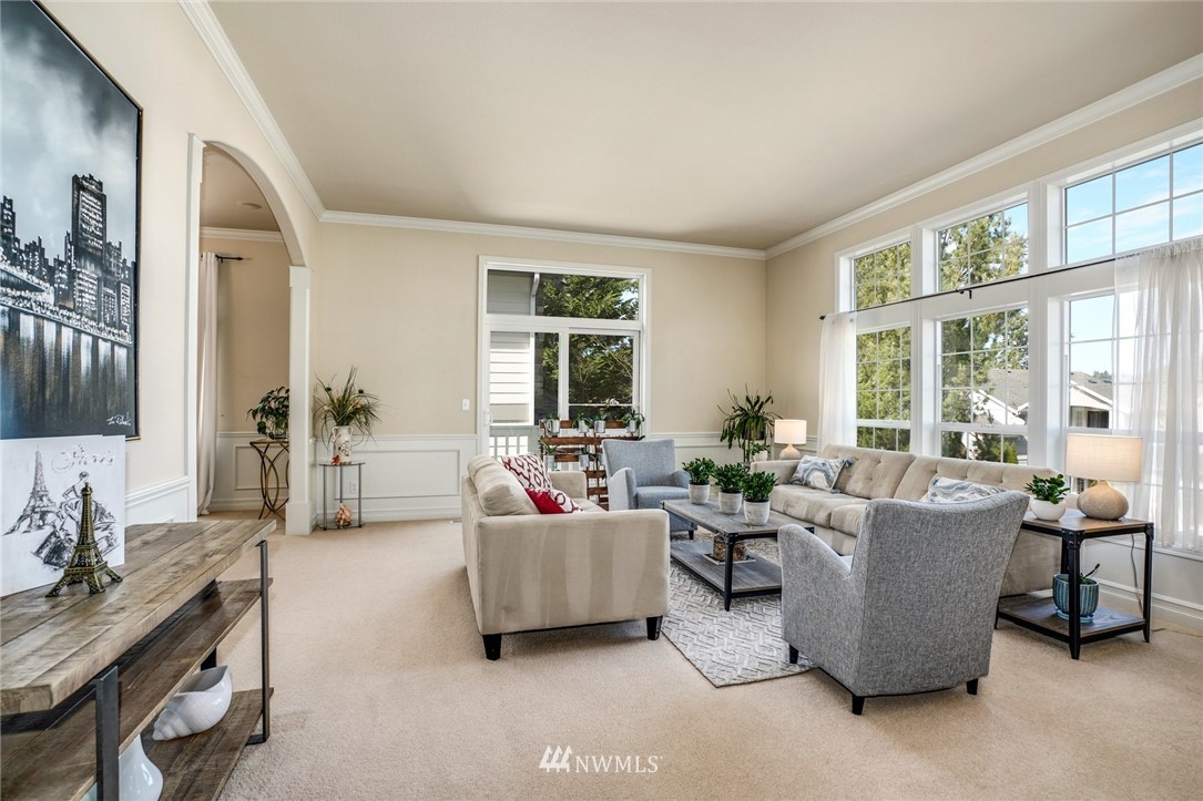 4113 Northeast 27th Place Renton, WA 98059 - Photo 5 of 27 a living room with furniture and a large window