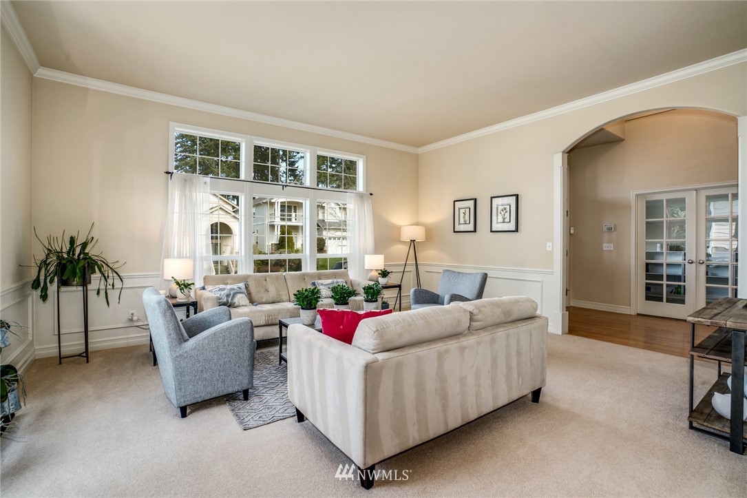 4113 Northeast 27th Place Renton, WA 98059 - Photo 7 of 27 a living room with furniture and white walls