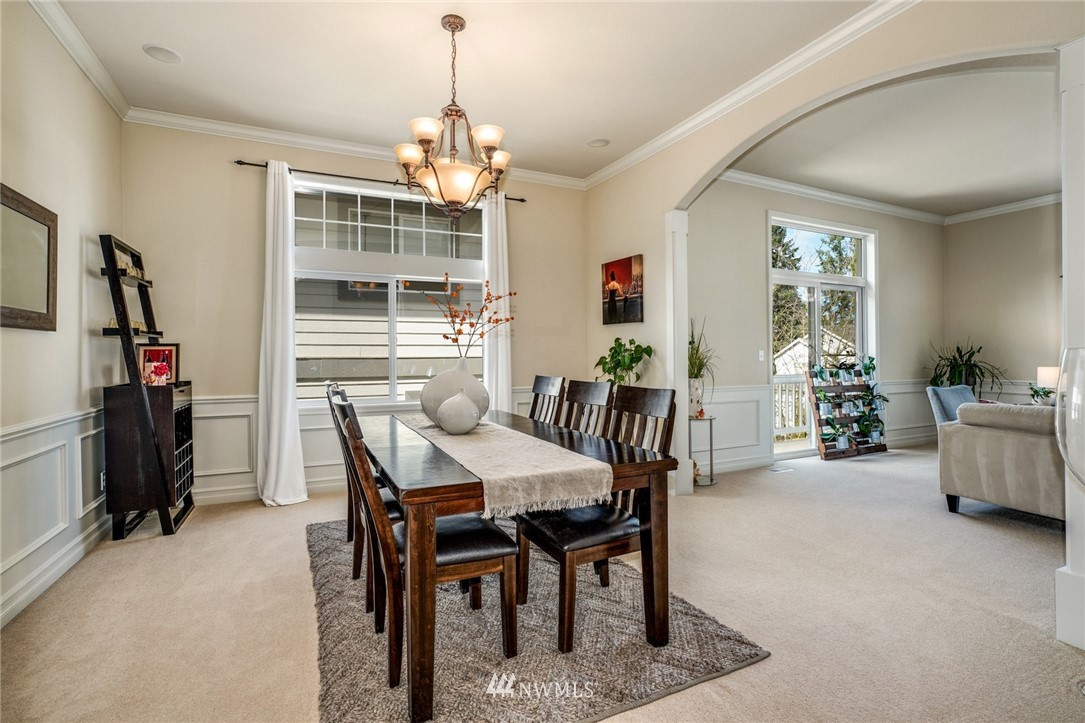 4113 Northeast 27th Place Renton, WA 98059 - Photo 8 of 27 a view of a dining room with furniture and window