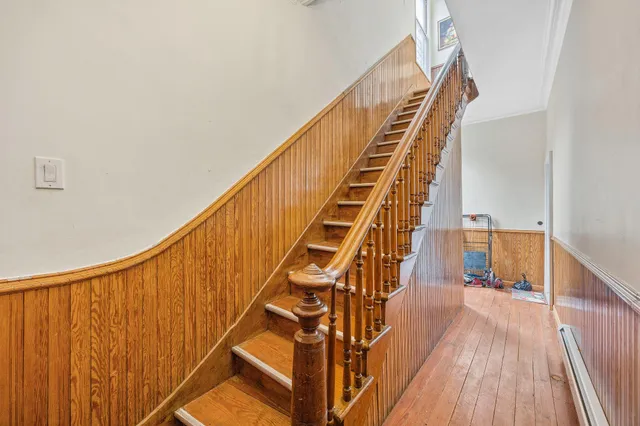 a view of entryway with wooden floor