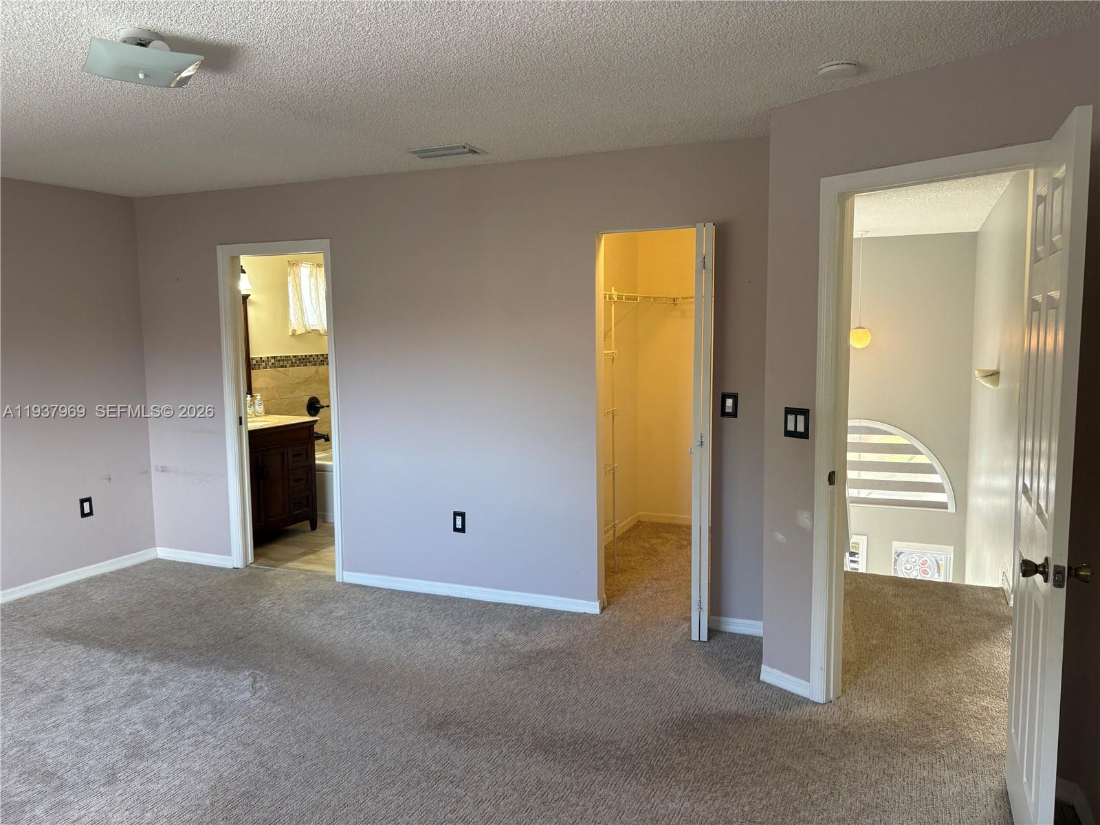 117 Danielle Court Weston, FL 33326 - Photo 13 of 43 an empty room with windows and closet