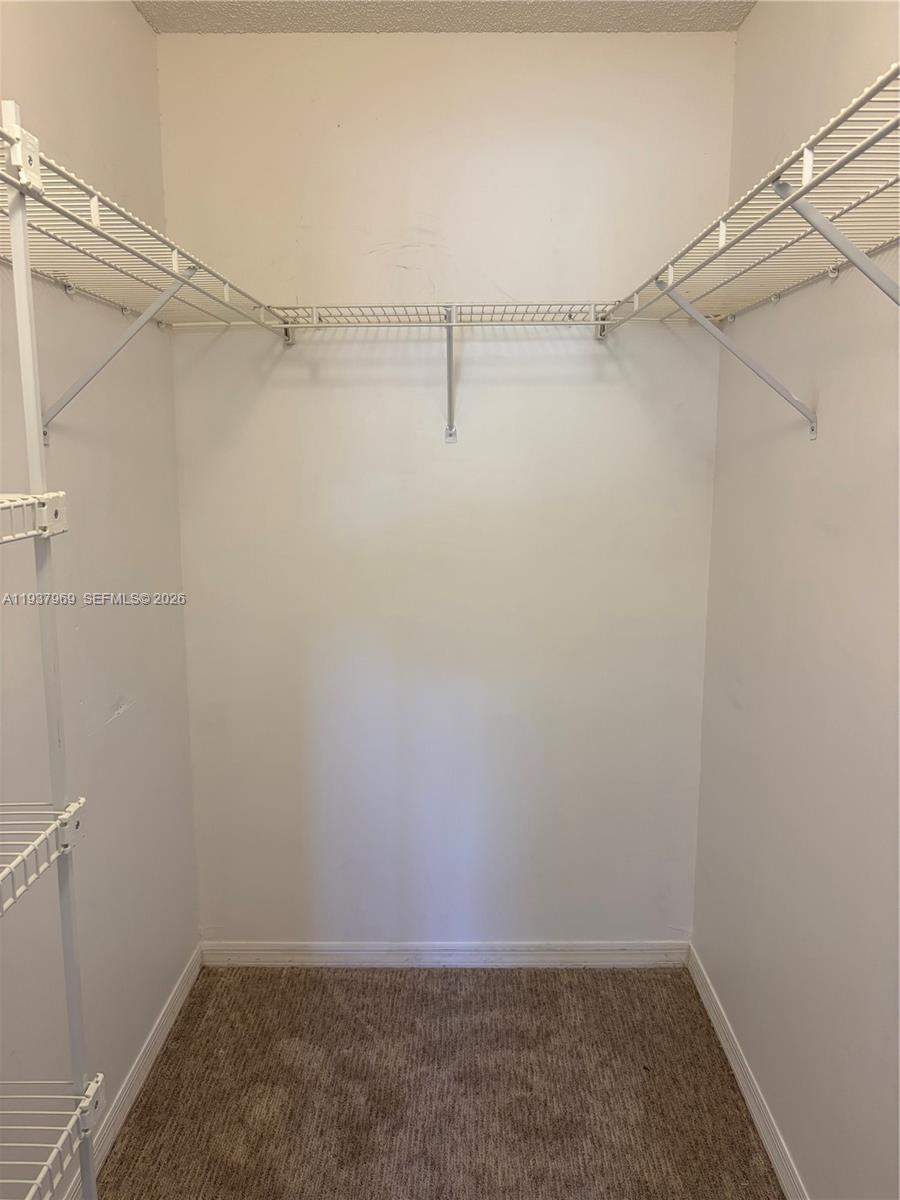 117 Danielle Court Weston, FL 33326 - Photo 15 of 43 a view of a room with racks on the wall