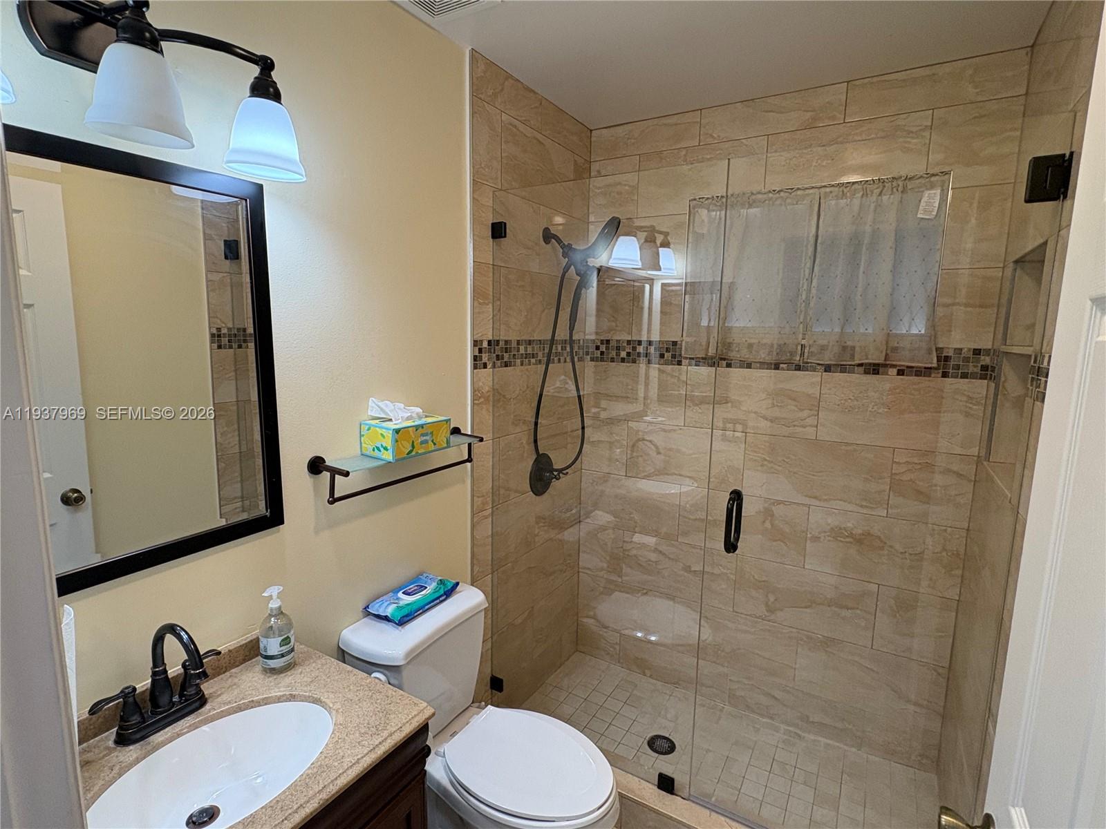 117 Danielle Court Weston, FL 33326 - Photo 21 of 43 a bathroom with a sink toilet and shower