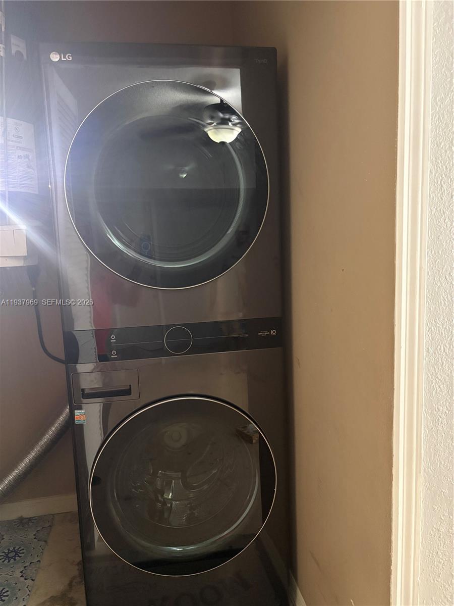 117 Danielle Court Weston, FL 33326 - Photo 23 of 43 a close up view of washer and dryer