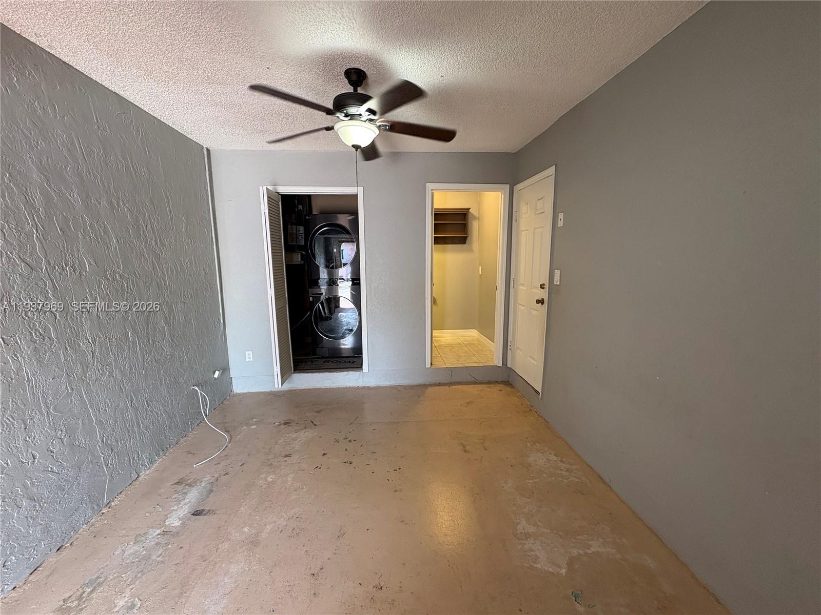 117 Danielle Court Weston, FL 33326 - Photo 24 of 43 a view of an empty room with window and chandelier fan