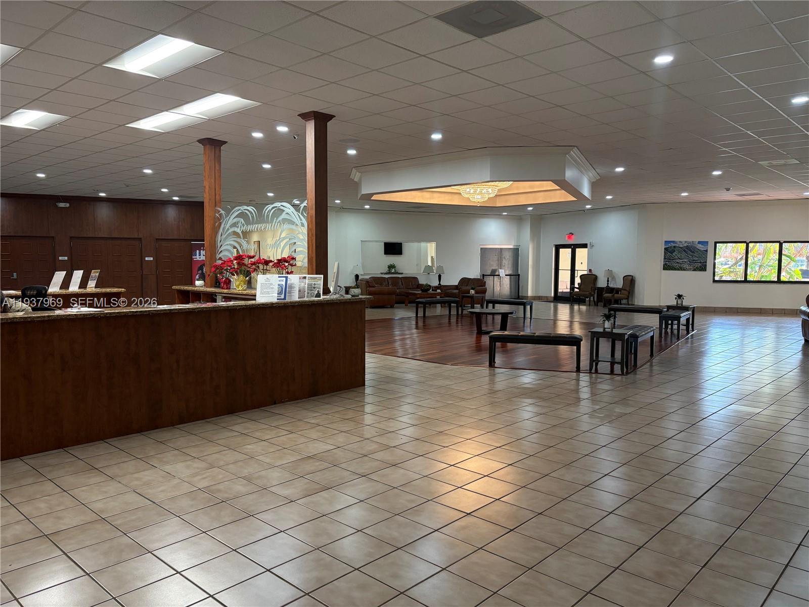 117 Danielle Court Weston, FL 33326 - Photo 30 of 43 a view of kitchen and dining room with wooden floor