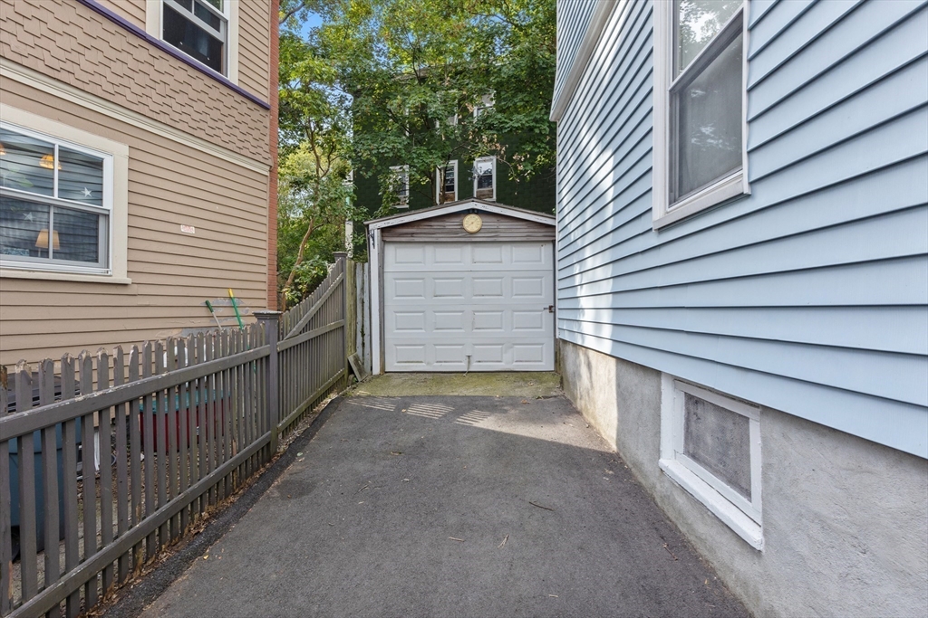 66 Round Hill Street Boston, MA 02130 - Photo 13 of 17 a view of backyard and deck