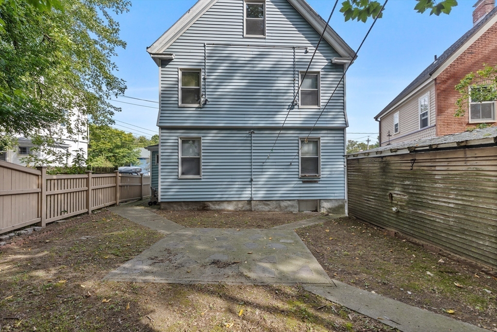 66 Round Hill Street Boston, MA 02130 - Photo 16 of 17 a view of a house with a yard