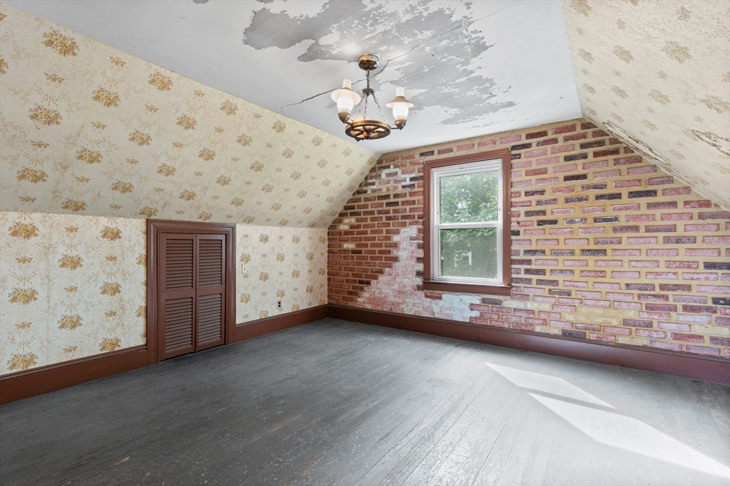 66 Round Hill Street Boston, MA 02130 - Photo 10 of 17 a view of an empty room with windows
