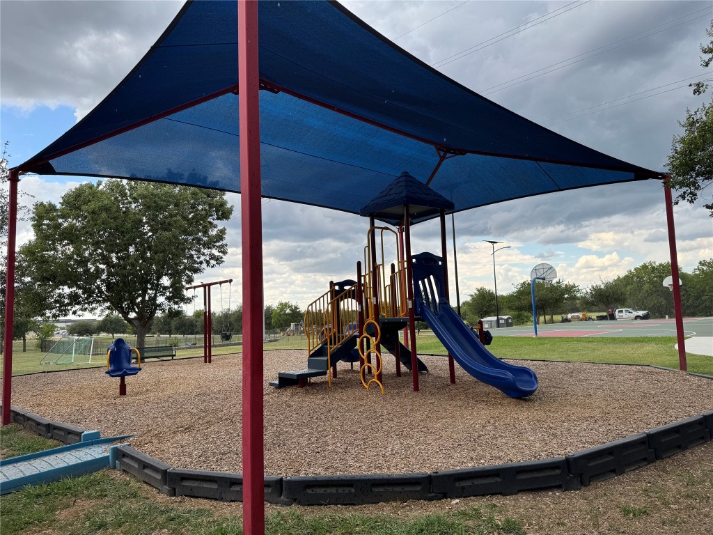 5054 Old Goforth Road Buda, TX 78610 - Photo 27 of 28 a view of a park with slide