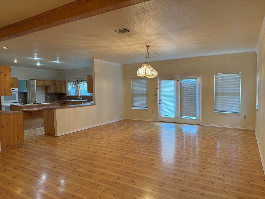 5054 Old Goforth Road Buda, TX 78610 - Photo 3 of 28 a view of a kitchen with a sink