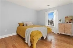 a bedroom with a bed and dresser