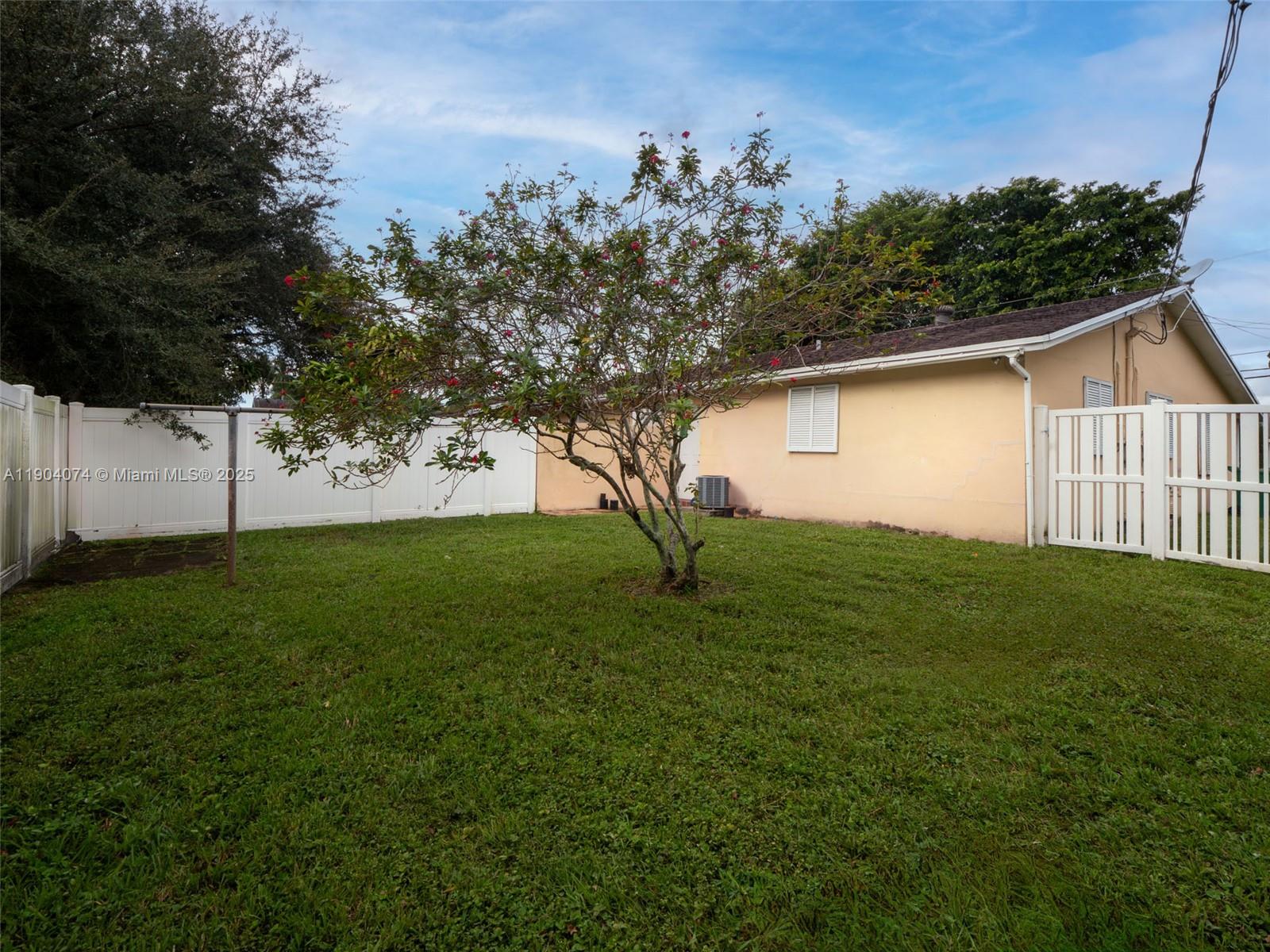 6510 Southwest 49th Street Davie, FL 33314 - Photo 13 of 26 a view of a backyard with plants and large trees