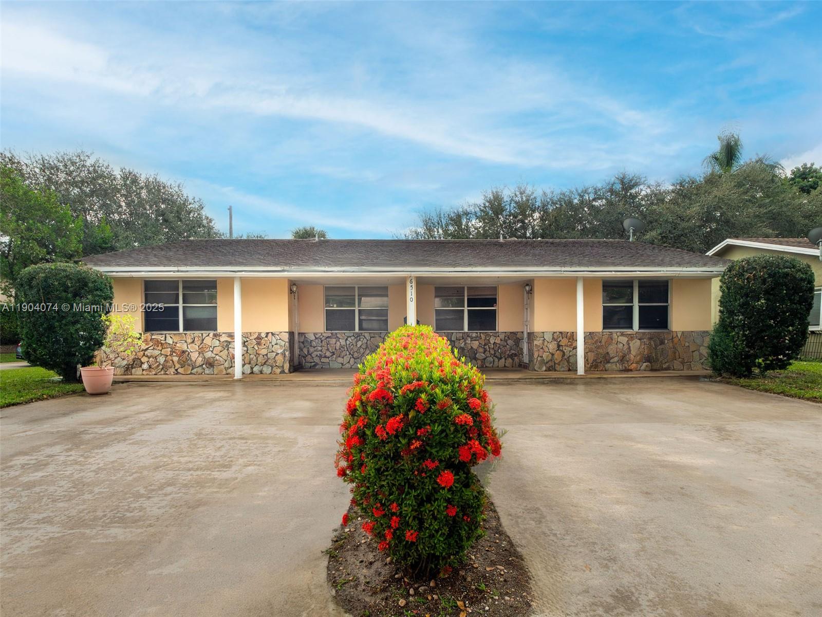 6510 Southwest 49th Street Davie, FL 33314 - Photo 2 of 26 front view of house with a yard